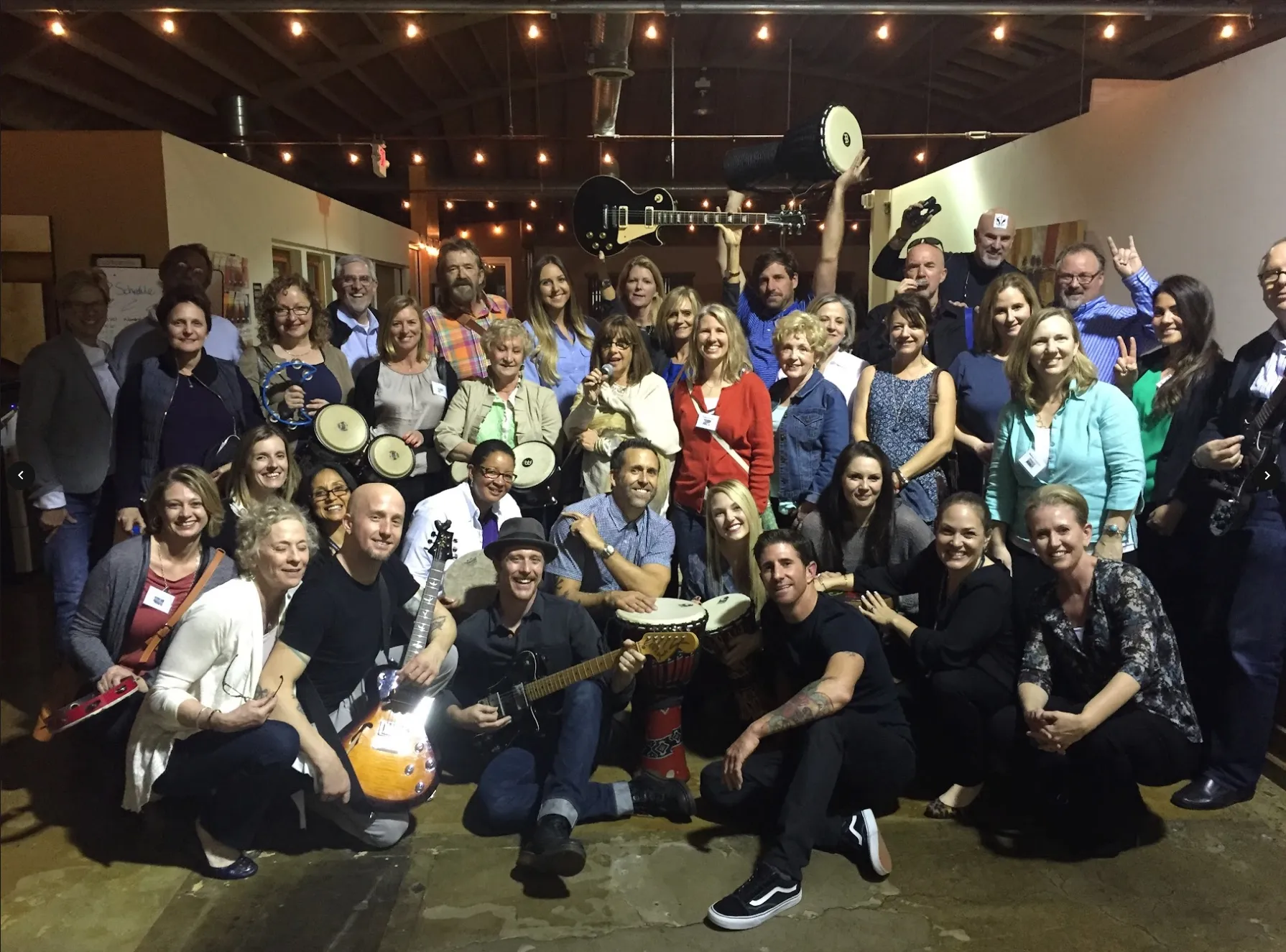Corporate team after a BandJAM session with their instruments.