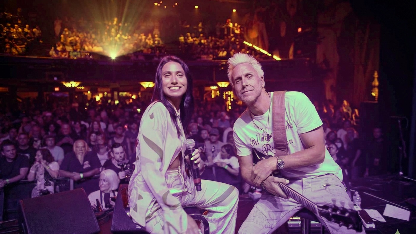 Two performers on stage together in front of a sold-out Fonda Theatre audience