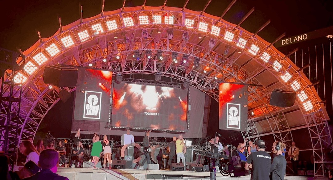 BandJAM's lit arch stage at Daylight Beach Club, Mandalay Bay, during the Accor activation at IMEX America